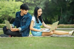 Teenagers Outside with Laptops