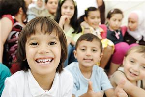 Smiling children sitting in a group